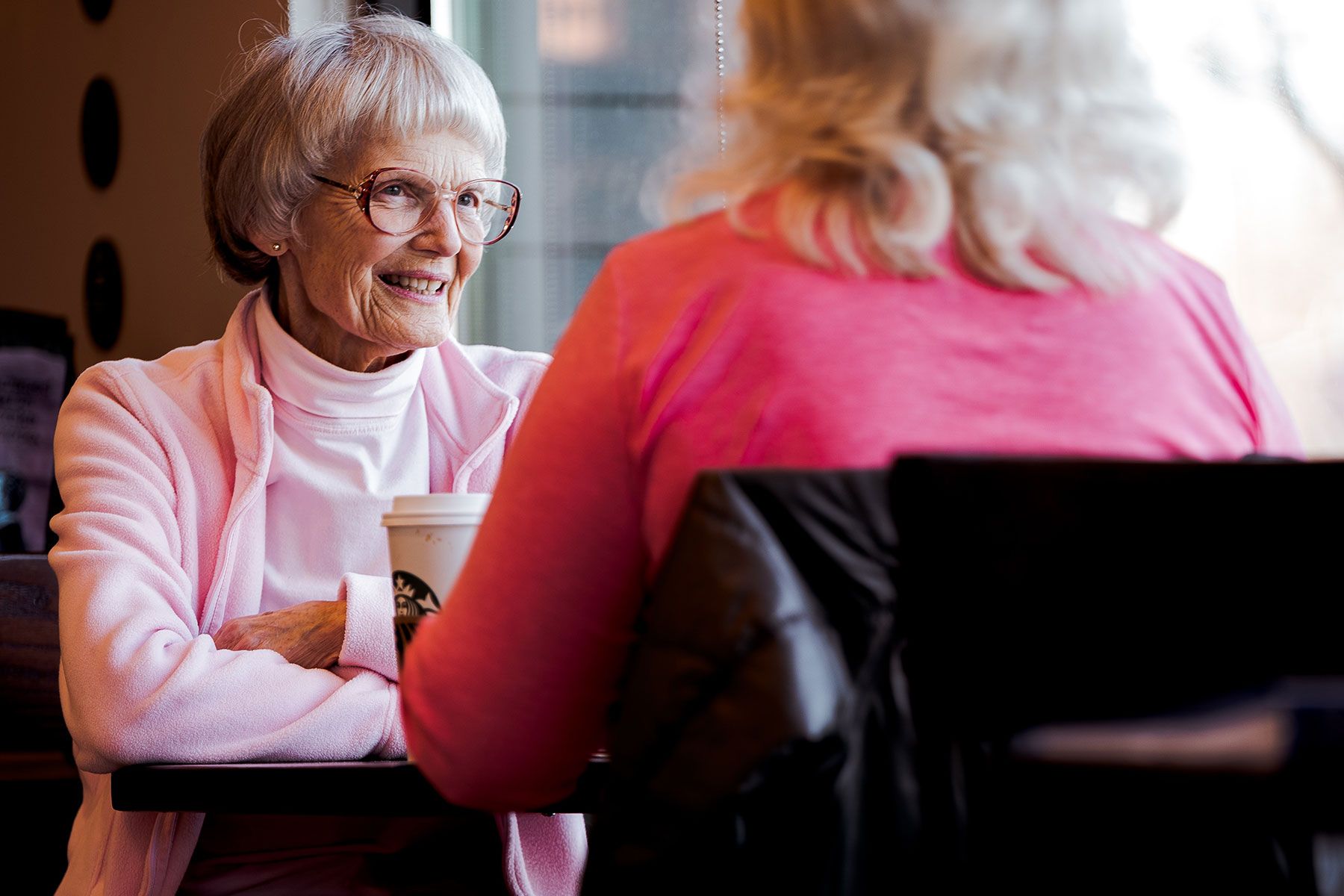 senior sitting with woman